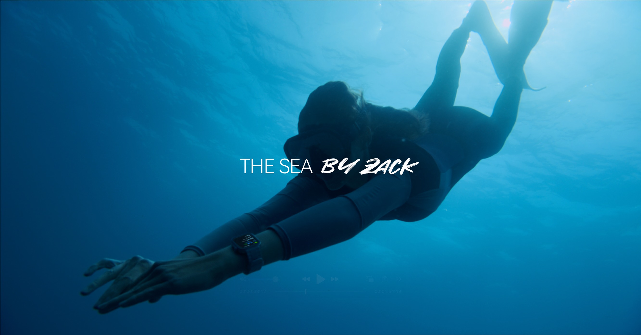 Freediver moving through deep blue water